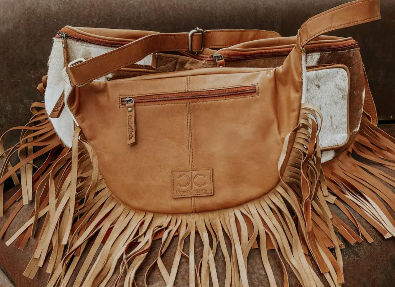 COWHIDE SLING BAG