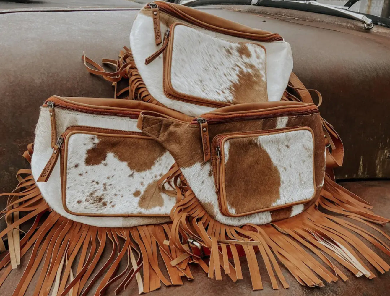 COWHIDE SLING BAG